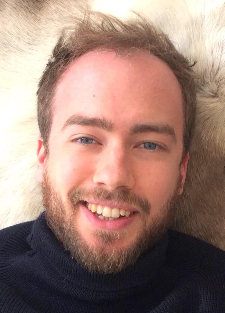 A headshot of Oskar Cox Jensen